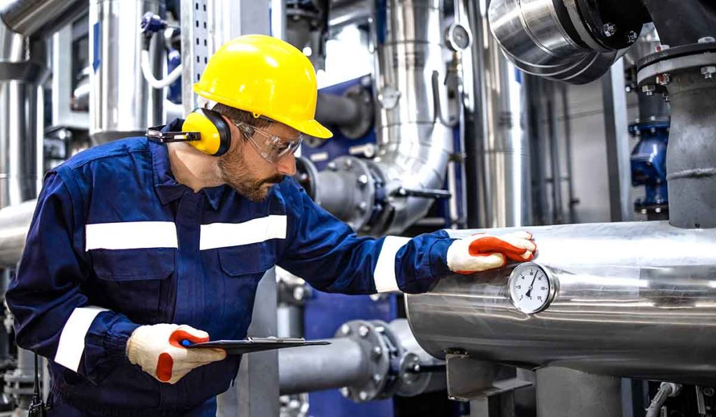 Maintenance technician doing a routine check on equipment.